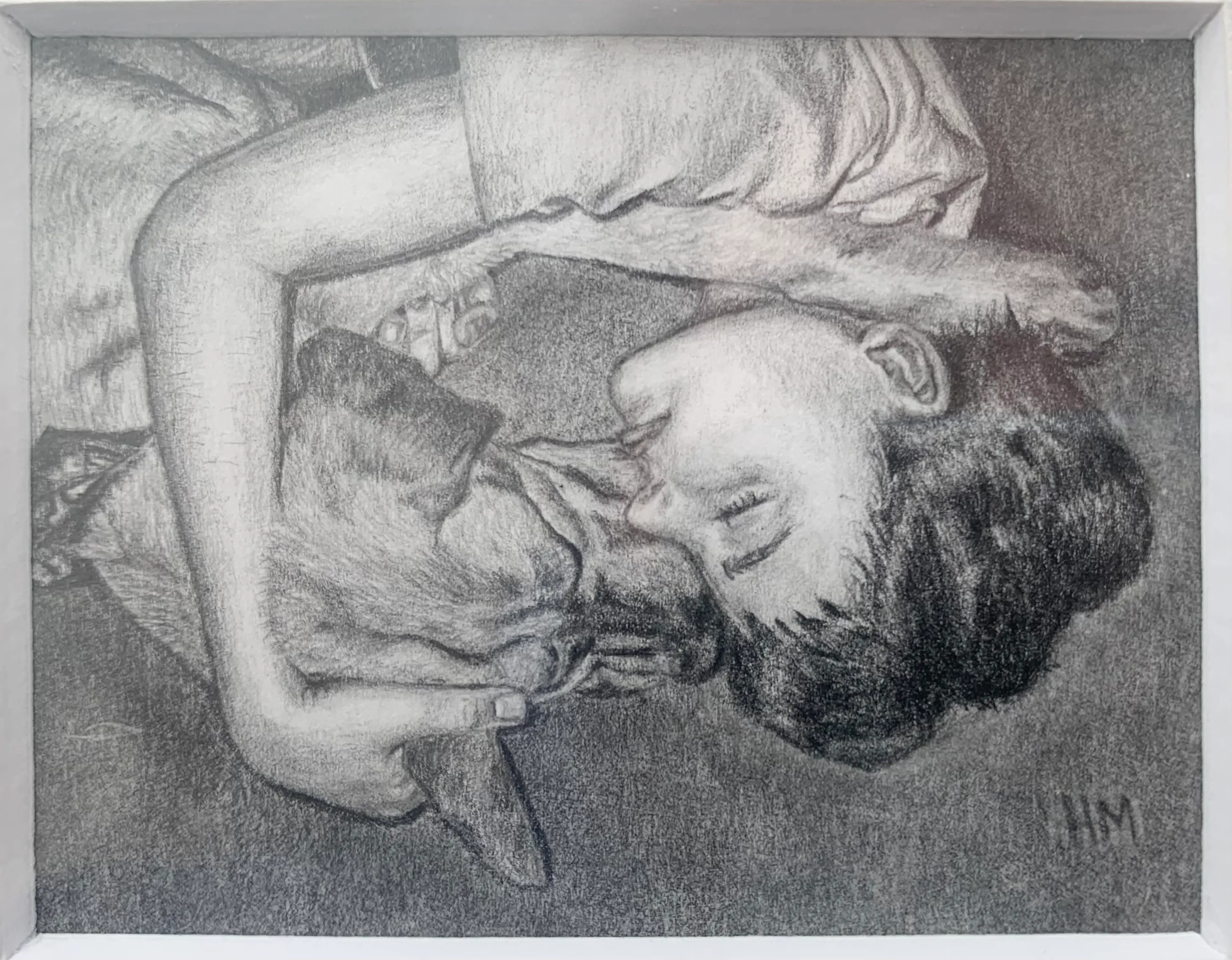 Graphite drawing of a person lying face to face with their dog in a quiet, tender moment.